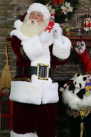 Santa Paul listening to an Elf on the Shelf on Christmas Eve