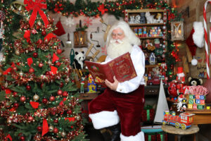 Santa Paul checking the Naughty & Nice Book